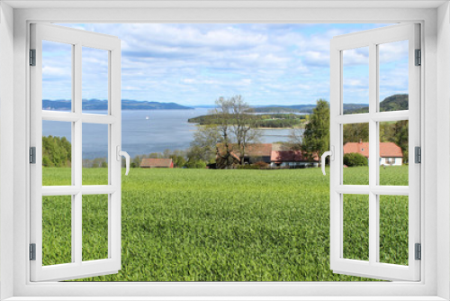 Fototapeta Naklejka Na Ścianę Okno 3D - Norwegian farmhouse with a view of the fjord 