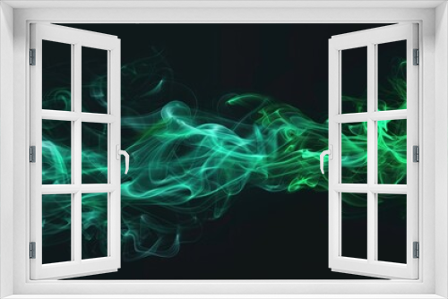 Green smoke on black background. Abstract smoke moves in the dark. Design element