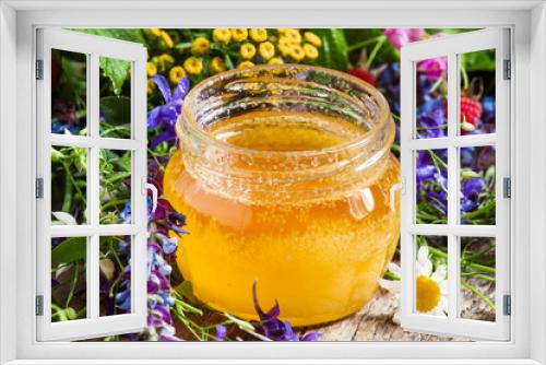Fototapeta Naklejka Na Ścianę Okno 3D - Honey and herbs on a wooden table, summer and healthy eating con