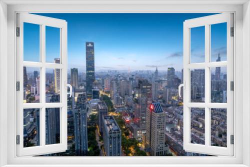 Fototapeta Naklejka Na Ścianę Okno 3D - Stunning Evening Skyline of Modern City