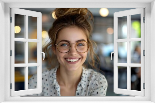 Young businesswoman with a laughing expression, some wearing eyeglasses, at the hiring interview in the office.