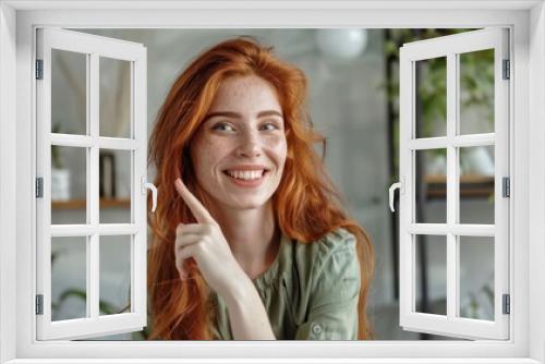 The smiling redhead woman