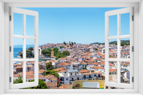 Fototapeta Naklejka Na Ścianę Okno 3D - Greek island panorama view, Skiathos old town, white washed town houses, Terracotta roofs, seascape with the blue Aegean water. holiday, vacation destination.