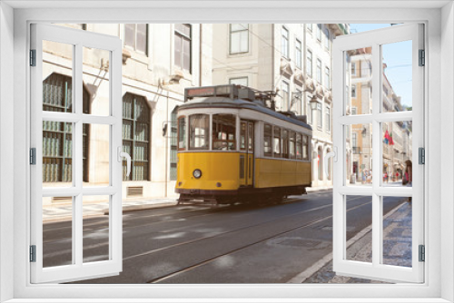 Fototapeta Naklejka Na Ścianę Okno 3D - Traditional yellow trams 