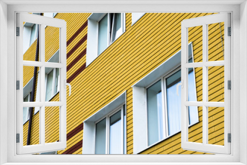 Fototapeta Naklejka Na Ścianę Okno 3D - Many windows in yellow brick building
