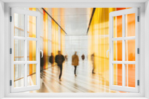 People walking through public passage space, long exposure with motion blur