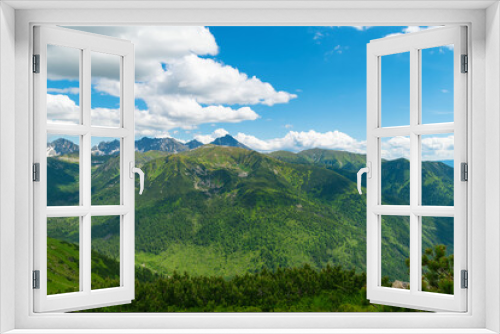 Fototapeta Naklejka Na Ścianę Okno 3D - Beautiful mountain landscape in summer. Green grass, high rocks, blue sky and white clouds. Natural background. Tatra Mountains