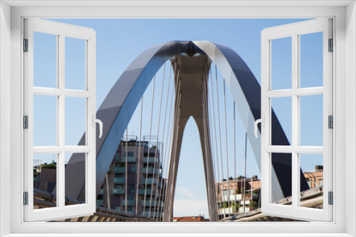 Fototapeta Naklejka Na Ścianę Okno 3D - modern footbridge with supporting arches and steel bulkheads