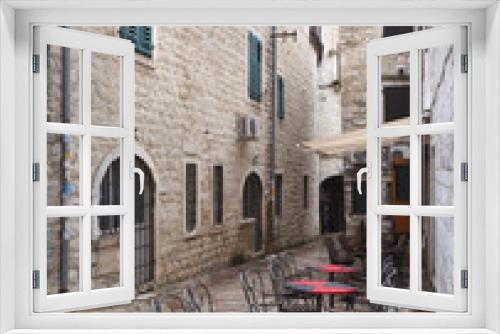 Fototapeta Naklejka Na Ścianę Okno 3D - Outdoor Resturant Tables After the Rain Kotor, Montenegro