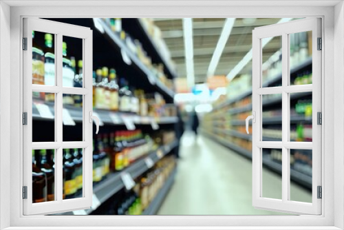 Blur wine bottles on liquor alcohol shelves in supermarket store background.