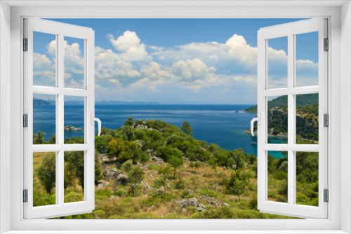 Fototapeta Naklejka Na Ścianę Okno 3D - view of mountainous coast on sunny day against blue sky