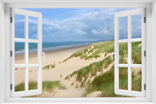 Fototapeta Naklejka Na Ścianę Okno 3D - The sand dunes system at Morfa Harlech National Nature Reserve, Harlech beach, Eryri, also known as Snowdonia, North Wales.