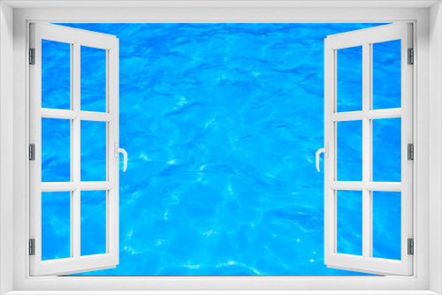 Fototapeta Naklejka Na Ścianę Okno 3D - Blue pool water with sun reflections