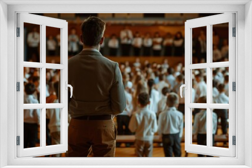 Engaged Teacher Supervising Students at School Event in Spacious Hall