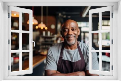 Smiling portrait of a confident middle aged male African American bartender