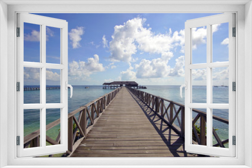 Fototapeta Naklejka Na Ścianę Okno 3D - endless jetty to the horizon; view to a turquoise sea and blue s