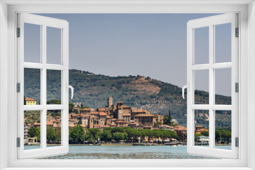 Fototapeta Naklejka Na Ścianę Okno 3D - Passignano seen from the Trasimeno lakeside in Umbria