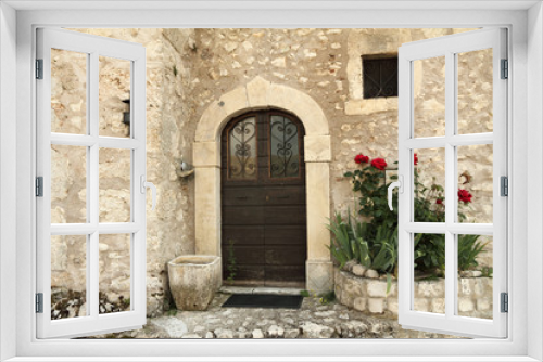 Fototapeta Naklejka Na Ścianę Okno 3D - old beautiful door and roses bed