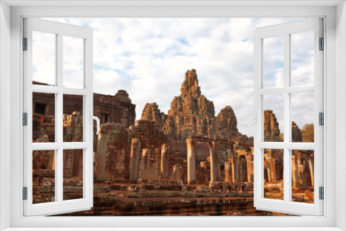 Fototapeta Naklejka Na Ścianę Okno 3D - Faces in Bayon Temple at sunset, Angkor Wat, Cambodia