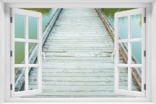 Fototapeta Naklejka Na Ścianę Okno 3D - Wooden Bridge over a Pond in the Park