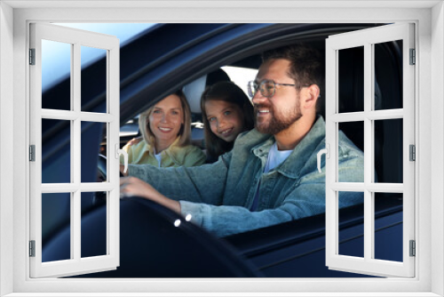 Happy family enjoying trip together by car, view from outside