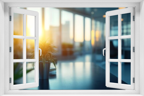 Sunlight streams through large windows, creating a warm atmosphere in a contemporary office filled with potted plants and a view of the city skyline