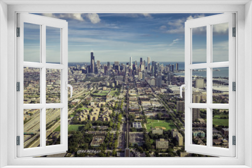 Fototapeta Naklejka Na Ścianę Okno 3D - Aerial view through Chicago Downtown with suburbs