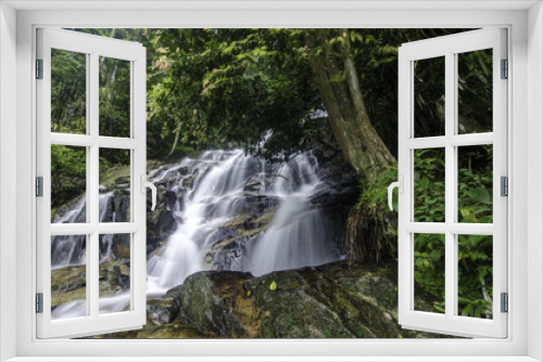 Fototapeta Naklejka Na Ścianę Okno 3D - Amazing waterfall flow, falling from the hill, green forest, wet and mossy on the rock