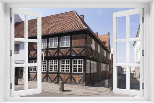 Fototapeta Naklejka Na Ścianę Okno 3D - Fachwerkhaus an der Ecke