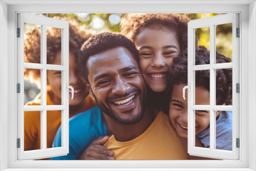 Happy family is having fun time and embracing together outdoors