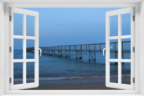 Fototapeta Naklejka Na Ścianę Okno 3D - Sunset pier at beach