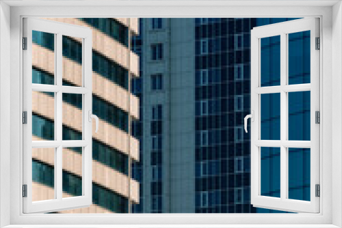 many windows and walls facade of a modern skyscraper without people