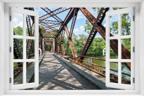 Fototapeta Naklejka Na Ścianę Okno 3D - Pedestrian Rail Trail crosses the Springtown Bridge over the Wallkill River in Upstate NY Near New Paltz on a bright summer day.