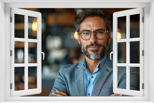 Professional man in a stylish restaurant attire confidently posing indoors during the day