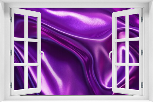 A close-up of smooth, shiny purple fabric with flowing textures.