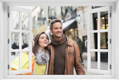 Portrait of a stylish couple doing their shopping in the city