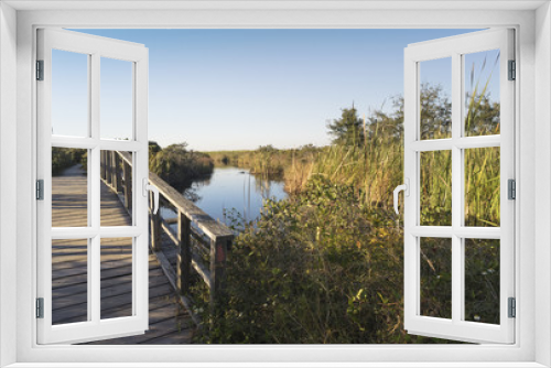 Fototapeta Naklejka Na Ścianę Okno 3D - Wooden Footbridge over canal at Fort Pickens, Florida