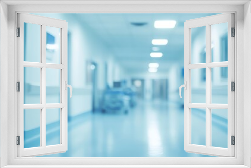 A blurred view of a hospital corridor, emphasizing a clinical and sterile environment.