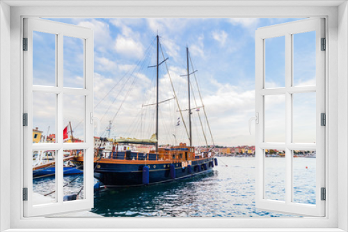 Fototapeta Naklejka Na Ścianę Okno 3D - A galleass anchored among ships in the Adriatic sea with a view of the old city core buildings on the coast