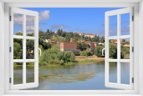Fototapeta Naklejka Na Ścianę Okno 3D - Plants and old buildings on riverside of Arno River. Florence.