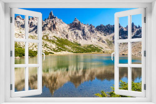 Fototapeta Naklejka Na Ścianę Okno 3D - Mountains reflecting in Laguna Toncek lake near Bariloche, Argentina