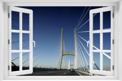 Fototapeta Naklejka Na Ścianę Okno 3D - Driving along car the Vasco da Gama Bridge