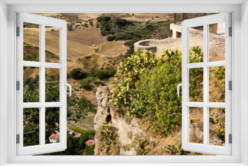 Fototapeta Naklejka Na Ścianę Okno 3D - View down the steep rockface to valley in Ronda