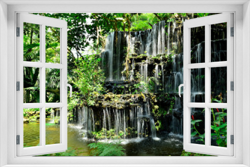 Fototapeta Naklejka Na Ścianę Okno 3D - Artificial waterfall in botanic garden