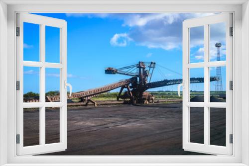 Fototapeta Naklejka Na Ścianę Okno 3D - Loading iron ore conveyor machine in steel industry