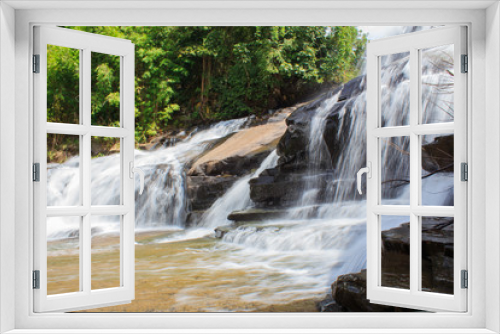 Fototapeta Naklejka Na Ścianę Okno 3D - Deep forest waterfall at Thaisantisuk waterfall National Park Kh