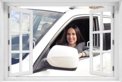 alluring young woman driving a car