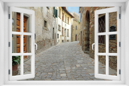 Fototapeta Naklejka Na Ścianę Okno 3D - paved narrow street in italian village, Tuscany