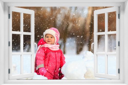 cute happy little girl play in winter