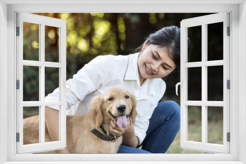 Fototapeta Naklejka Na Ścianę Okno 3D - Portrait of a happy woman with her golden dog in park.